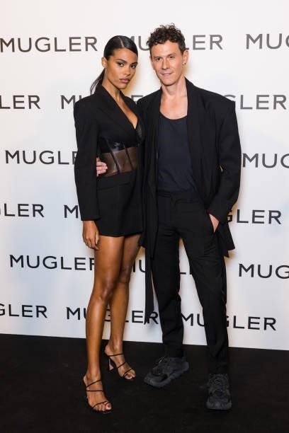 Model Tina Kunakey and Casey Cadwallader attend the "Thierry Mugler : Couturissime