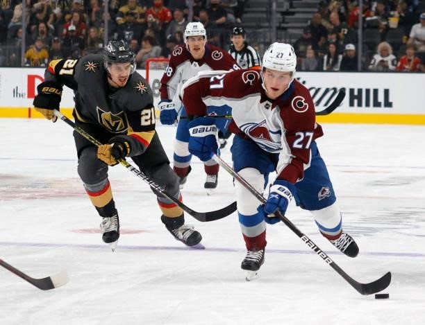 Oskar Olausson of the Colorado Avalanche skates with the puck against Brett Howden of the Vegas Golden Knights in the first period of their preseason...
