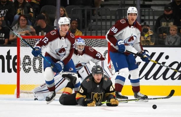 Justin Barron, Pavel Francouz and Andreas Englund of the Colorado Avalanche and Jonas Rondbjerg of the Vegas Golden Knights watch the puck in the...