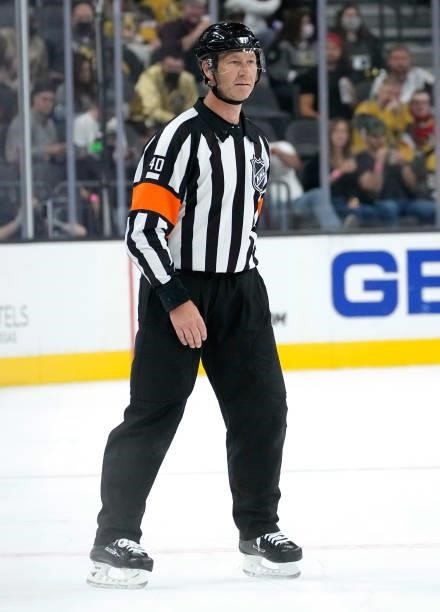 Referee Steve Kozari is seen on ice during a game between the Vegas Golden Knights and Colorado Avalanche at T-Mobile Arena on September 28, 2021 in...
