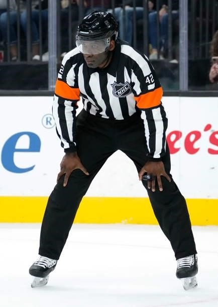 Referee Jordan Samuels-Thomas is seen on the ice during a game between the Vegas Golden Knights and Colorado Avalanche at T-Mobile Arena on September...
