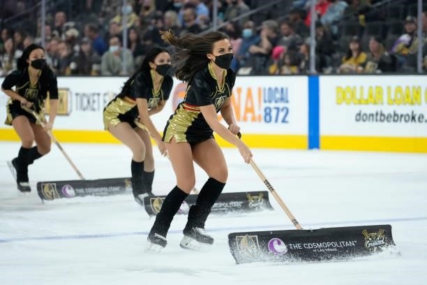 The Knights Guard clean the ice during a game between the Vegas Golden Knights and the Colorado Avalanche at T-Mobile Arena on September 28, 2021 in...