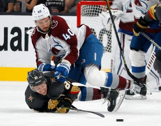 Jonathan Marchessault of the Vegas Golden Knights gets rid of the puck under pressure from Artem Anisimov of the Colorado Avalanche in the first...