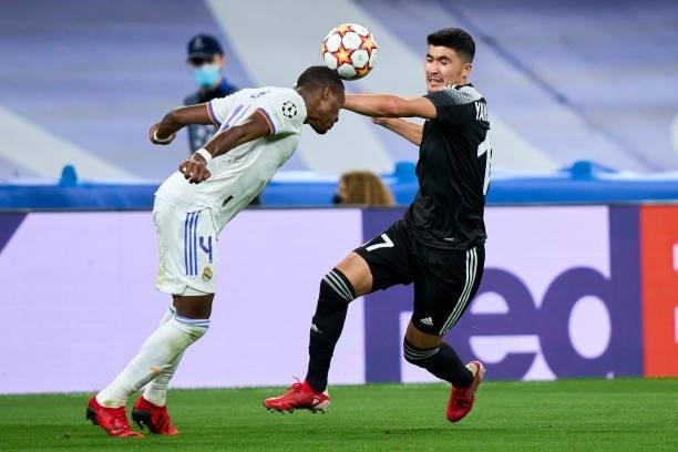 David Alaba of Real Madrid battle for the ball Jasur Yakhshiboev of FC Sheriff during the UEFA Champions League group D match between Real Madrid and...