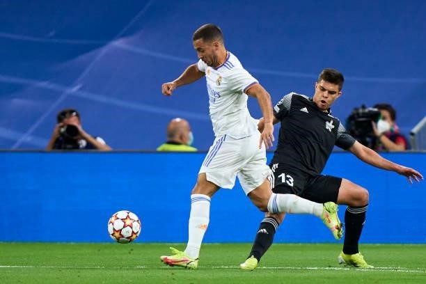 Eden Hazard of Real Madrid battle for the ball Fernando Costanza of FC Sheriff during the UEFA Champions League group D match between Real Madrid and...