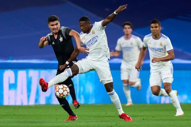 David Alaba of Real Madrid battle for the ball Jasur Yakhshiboev of FC Sheriff during the UEFA Champions League group D match between Real Madrid and...