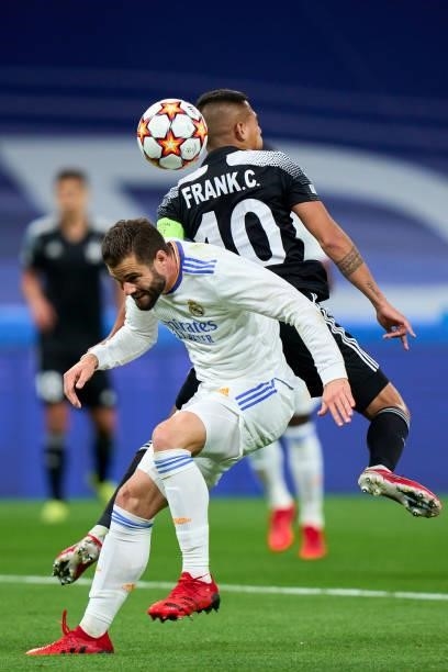 Nacho Fernandez of Real Madrid battle for the ball Frank Castaneda of FC Sheriff during the UEFA Champions League group D match between Real Madrid...