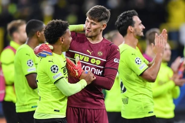 Donyell Malen of Dortmund and Gregor Kobel of Dortmund after the UEFA Champions League group C match between Borussia Dortmund and Sporting CP at...