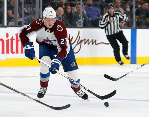 Oskar Olausson of the Colorado Avalanche skates with the puck against the Vegas Golden Knights in the first period of their preseason game at...