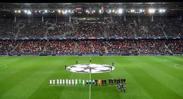 The teams of Red Bull Salzburg and Lille OSC line up on the pitch before the UEFA Champions League group G match between FC Red Bull Salzburg and...