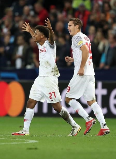 Karim Adeyemi of FC Red Bull Salzburg celebrates scoring his sides first goal from a penalty during the UEFA Champions League group G match between...