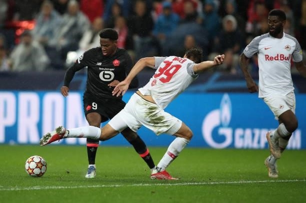 Jonathan David of Lille with Max Wober of FC Red Bull Salzburg during the UEFA Champions League group G match between FC Red Bull Salzburg and Lille...