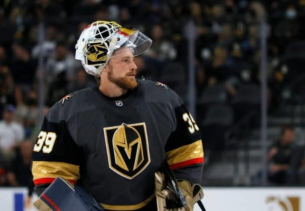 Laurent Brossoit of the Vegas Golden Knights takes a break during a stop in play in the second period of a preseason game against the Colorado...