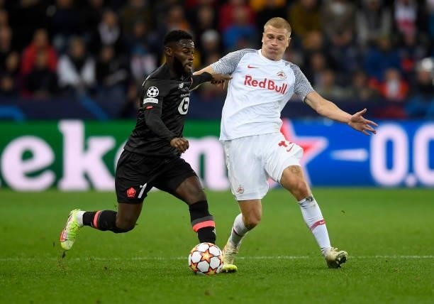 Rasmus Kristensen of Red Bull Salzburg fights for the ball with Jonathan Bamba of Lille OSC during the UEFA Champions League group G match between FC...