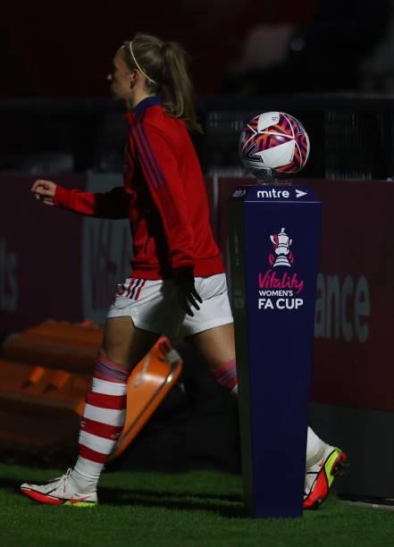 View of the ball on the branded plinth as Jordan Nobbs of Arsenal walks past ahead of the Vitality Women's FA Cup Quarter Final match between Arsenal...