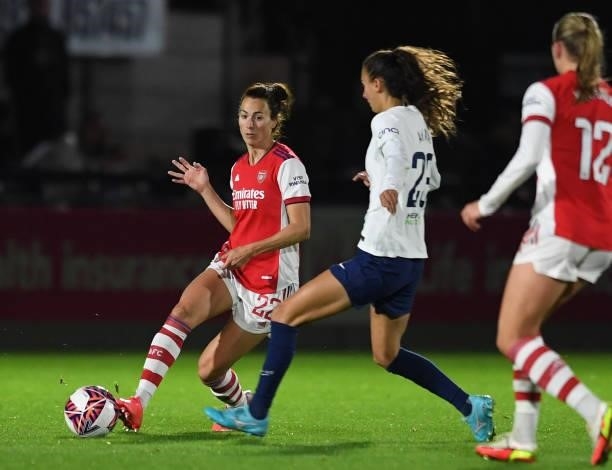 Viki Schnaderbeck of Arsenal passes the ball under pressure from Rosella Ayane of Tottenham during the Women's FA Cup Quarter Final between Arsenal...