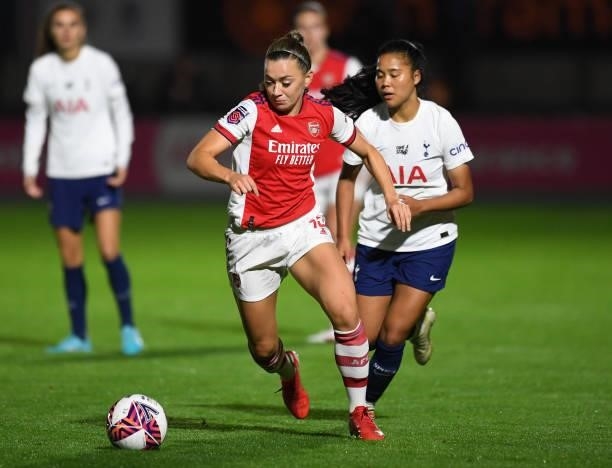 Katie McCabe of Arsenal takes on Asmite Ale of Tottenham during the Women's FA Cup Quarter Final between Arsenal Women and Tottenham Hotspur Women at...