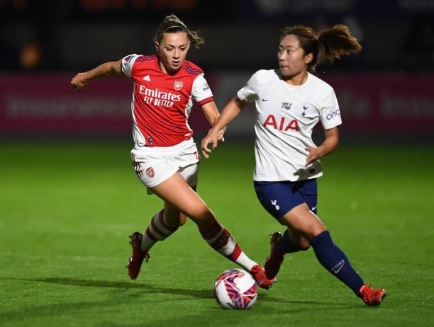 Katie McCabe of Arsenal closes down Asmite Ale of Tottenham during the Women's FA Cup Quarter Final between Arsenal Women and Tottenham Hotspur Women...