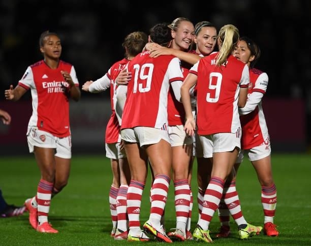Caitlin Foord celebrates scoring Arsenal's 5th goal her 2nd with Frida Maanum and Katie McCabe during the Women's FA Cup Quarter Final between...
