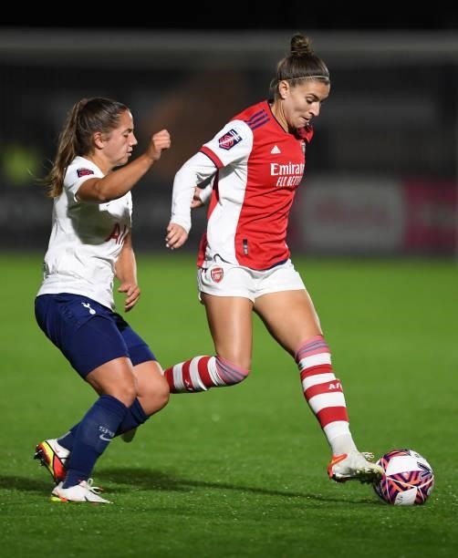 Steph Catley of Arsenal takes on Kit Graham of Tottenham during the Women's FA Cup Quarter Final between Arsenal Women and Tottenham Hotspur Women at...