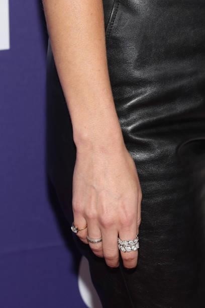 Dakota Johnson, ring detail, attends the premiere of "The Lost Daughter
