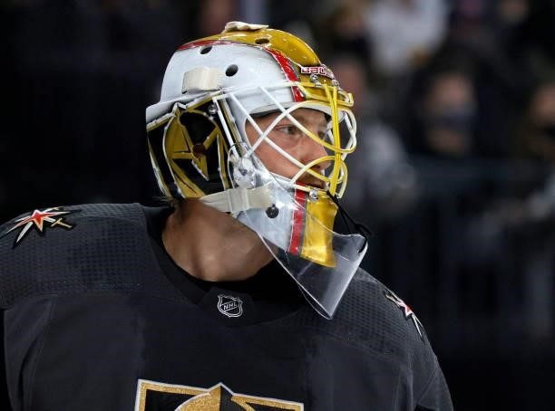 Laurent Brossoit of the Vegas Golden Knights takes a break during a stop in play in the third period of a preseason game against the Colorado...
