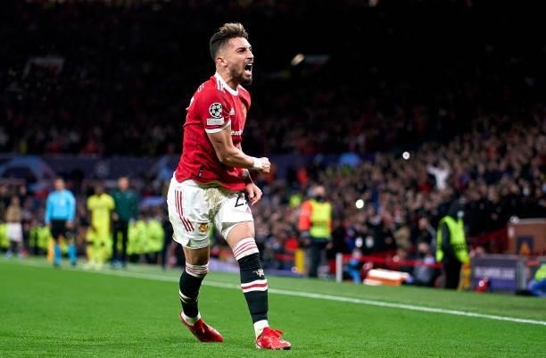 Alex Telles of Manchester United celebrates after scoring his team's first goal during the UEFA Champions League group F match between Manchester...