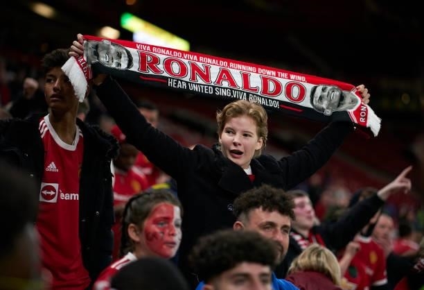 Fan holds up a scarf of Cristiano Ronaldo following the UEFA Champions League group F match between Manchester United and Villarreal CF at Old...