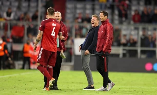 Coach Julian Nagelsmann of Bayern Muenchen and Niklas Suele of FC Bayern Muenchen after the UEFA Champions League group E match between FC Bayern...