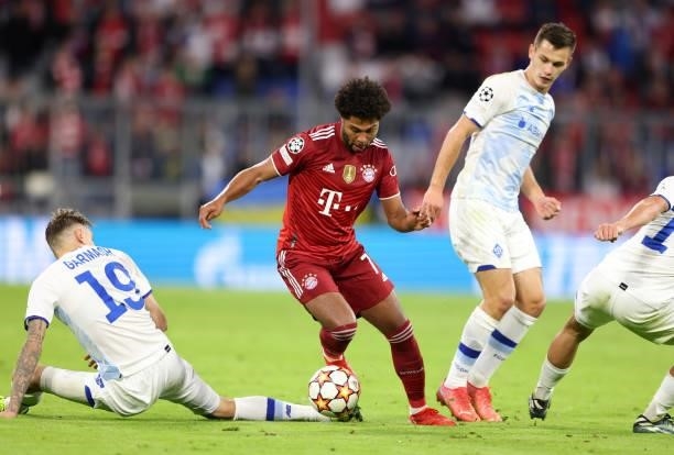 Serge Gnabry of Bayern Muenchen vies with Denys Garmash of Dynamo Kiew during the UEFA Champions League group E match between FC Bayern München and...
