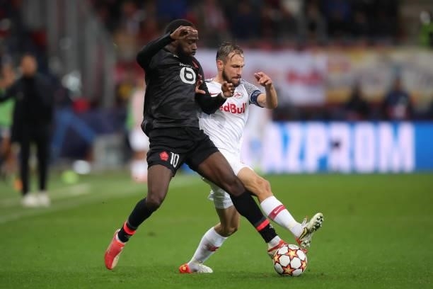 Andreas Ulmer of FC Red Bull Salzburg challenges Jonathan Ikone of Lille OSC during the UEFA Champions League group G match between FC Red Bull...