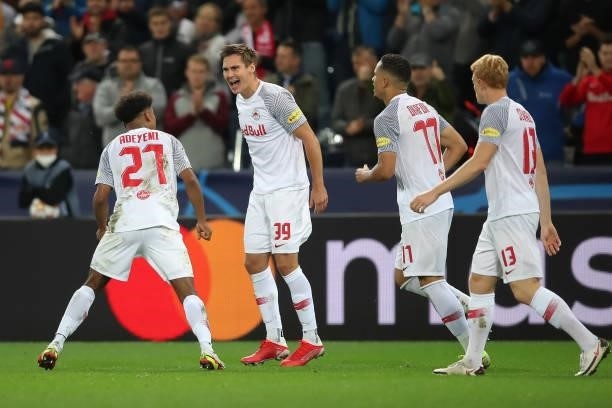 Karim Adeyemi of FC Red Bull Salzburg celebrates after scoring their side`s first goal with teammates during the UEFA Champions League group G match...