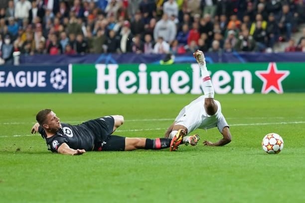 Karim Adeyemi of FC Red Bull Salzburg is tackled by Sven Botman of Lille OSC during the UEFA Champions League group G match between FC Red Bull...