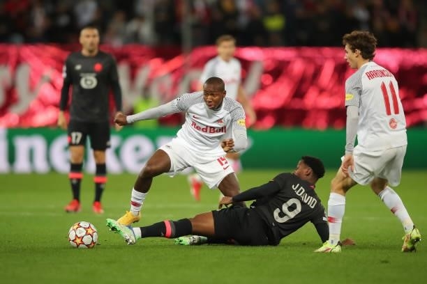 Mohamed Camara of FC Red Bull Salzburg challenges Jonathan David of Lille OSCduring the UEFA Champions League group G match between FC Red Bull...