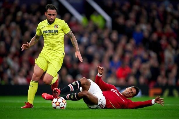 Paco Alcacer of Villarreal CF is tackled by Raphael Varane of Manchester United during the UEFA Champions League group F match between Manchester...