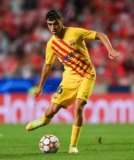 Pedri of FC Barcelona runs with the ball during the UEFA Champions League group E match between SL Benfica and FC Barcelona at Estadio da Luz on...