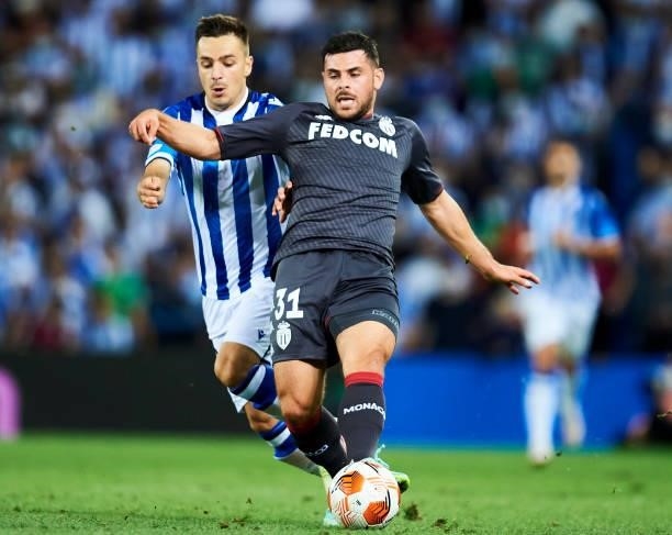 Martin Zubimi of Real Sociedad duels for the ball with Kevin Volland of AS Monaco during the UEFA Europa League group B match between Real Sociedad...