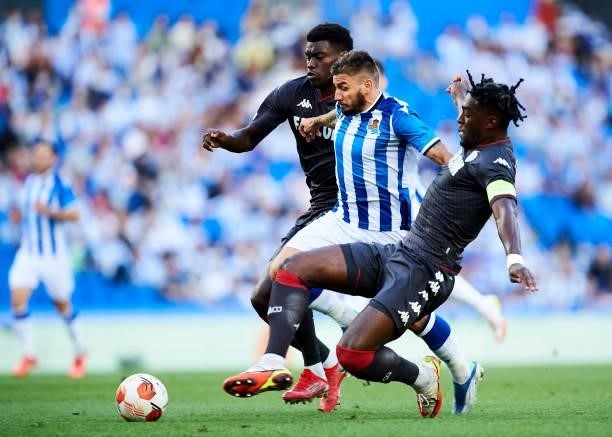 Cristian Portuguesl of Real Sociedad duels for the ball with Axel Disasi of AS Monaco during the UEFA Europa League group B match between Real...