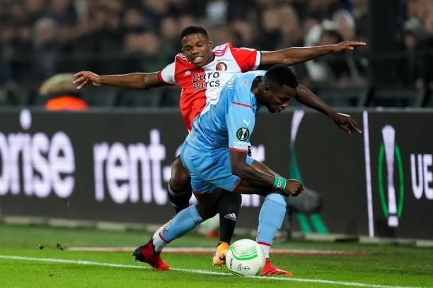 Tyrell Malacia of Feyenoord and Ubong Ekpai of Slavia Prague battle for possession during the UEFA Conference League Group Stage match between...