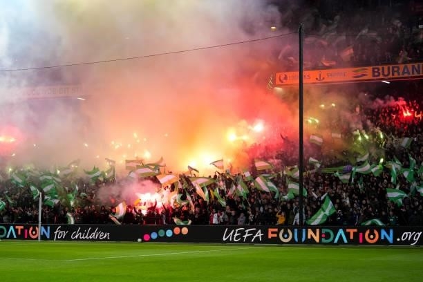 Fans of Feyenoord lighten fireworks during the UEFA Conference League Group Stage match between Feyenoord and Slavia Prague at Stadion Feijenoord on...