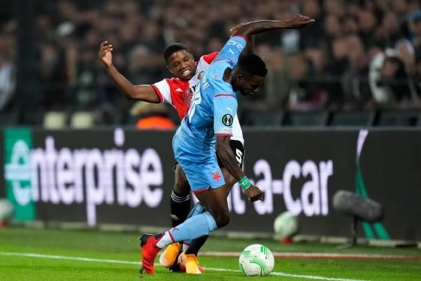 Tyrell Malacia of Feyenoord and Ubong Ekpai of Slavia Prague battle for possession during the UEFA Conference League Group Stage match between...