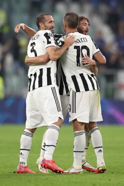 Giorgio Chiellini of Juventus celebrates with team mates Leonardo Bonucci and Manuel Locatelli of Juventus following the ifnal whistle of the UEFA...