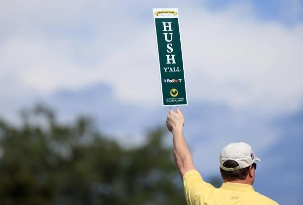 Volunteer holds a Hush Y'all sign during round one of the Sanderson Farms Championship at Country Club of Jackson on September 30, 2021 in Jackson,...