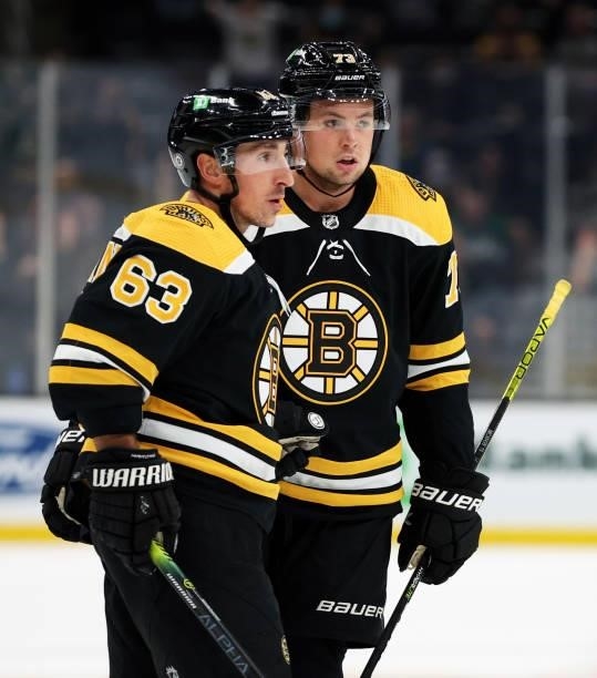 Brad Marchand of the Boston Bruins celebrates with Charlie McAvoy after scoring a goal against the Philadelphia Flyers during the first period of the...