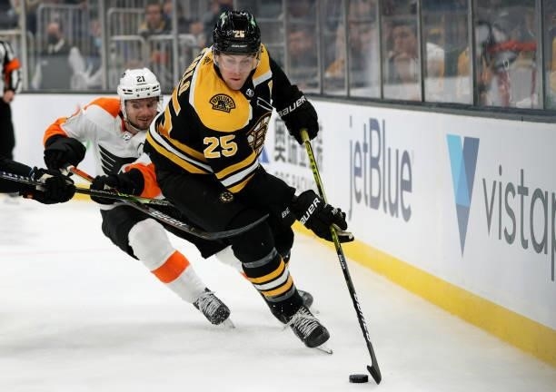 Scott Laughton of the Philadelphia Flyers defends Brandon Carlo of the Boston Bruins during the second period of the preseason game at TD Garden on...