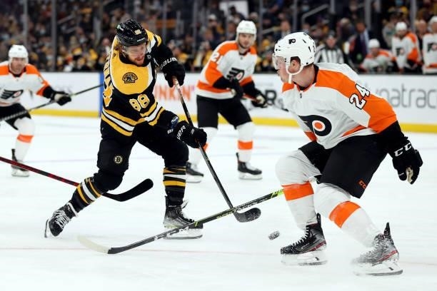 David Pastrnak of the Boston Bruins takes a shot against Mikhail Vorobyev of the Philadelphia Flyers during the first period of the preseason game at...