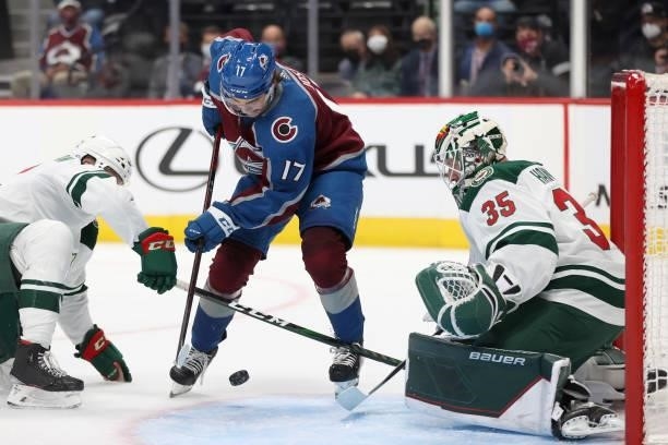 Tyson Jost of the Colorado Avalanche tries to score against Kevin Czuczman and goalie Andrew Hammond of the Minnesota Wild in the second period at...