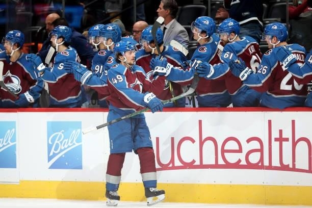 Samuel Girard of the Colorado Avalanche is congratulated by his teammates after scoring against the Minnesota Wild in the third period at Ball Arena...