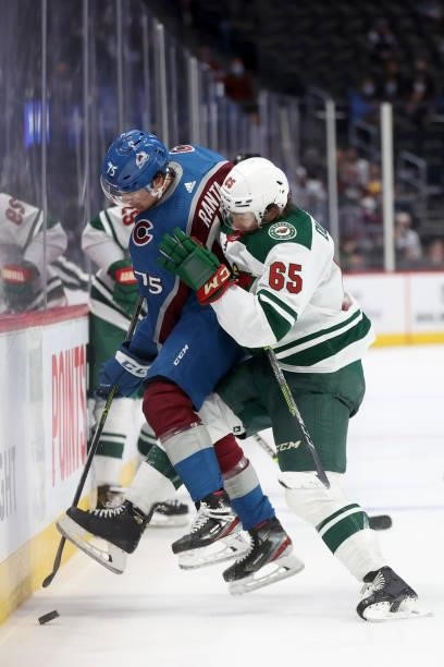 Sampo Ranta of the Colorado Avalanche fights for the puck on the boards against Brandon Duhaime of the Minnesota Wild in the third period at Ball...