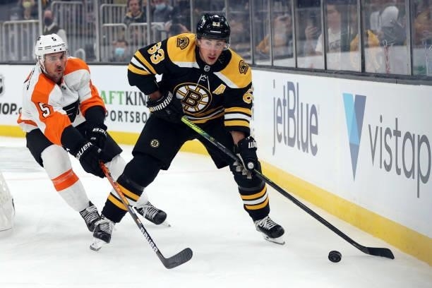 Brad Marchand of the Boston Bruins skates against Adam Clendening of the Philadelphia Flyers during the first period of the preseason game at TD...